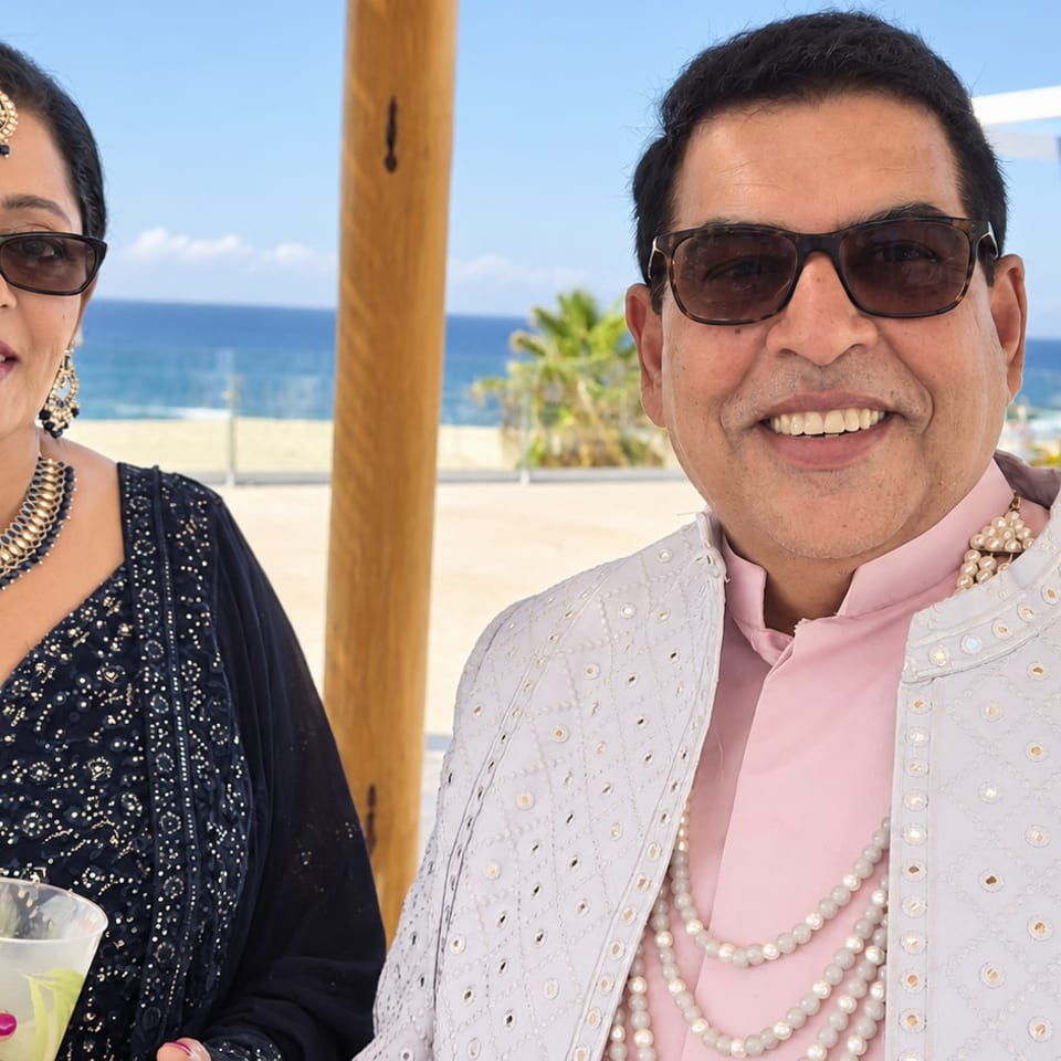 Two guests at a beachside celebration