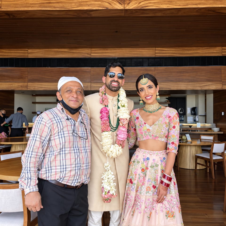 Three wedding guests in a wood-paneled venue