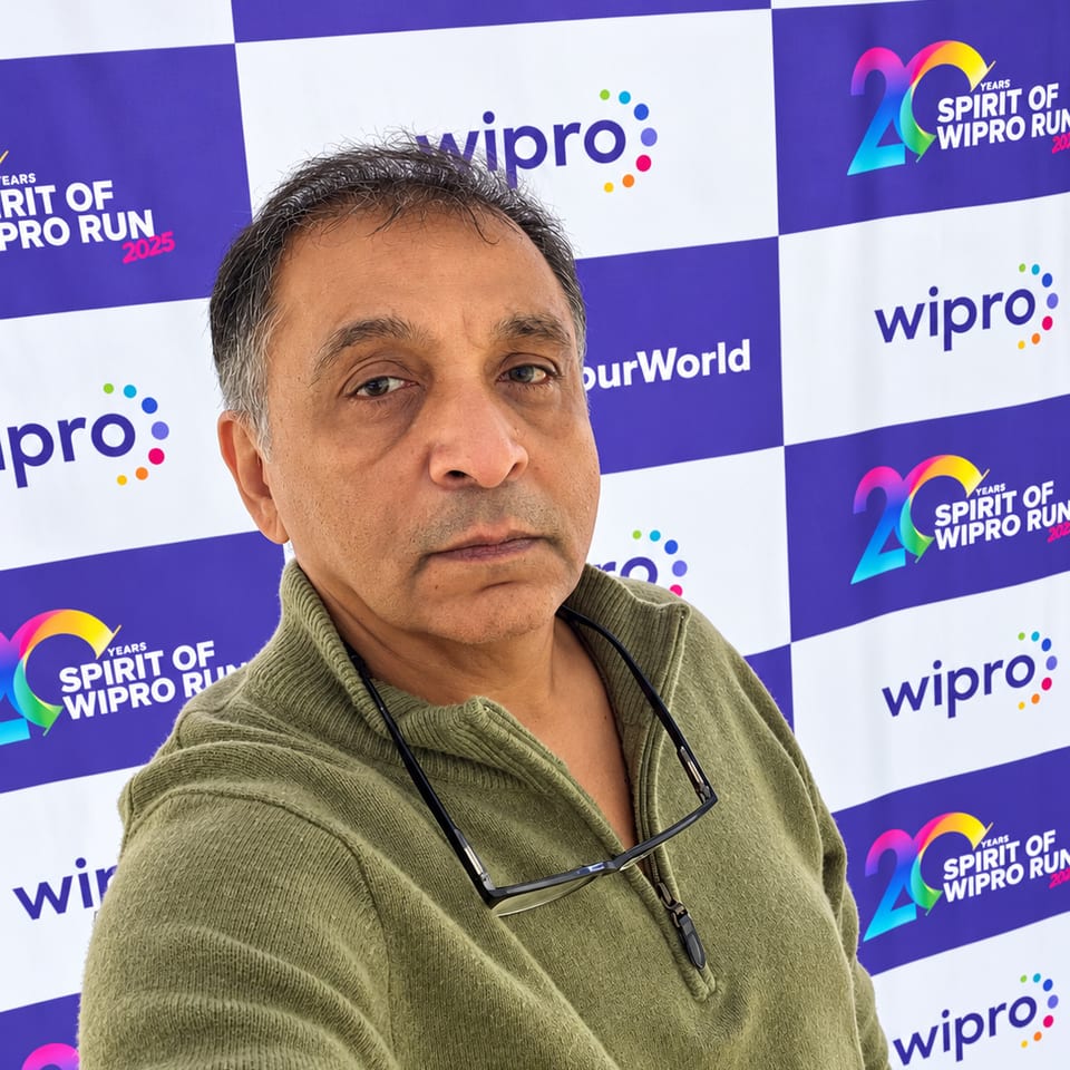 Guest in front of a corporate event backdrop