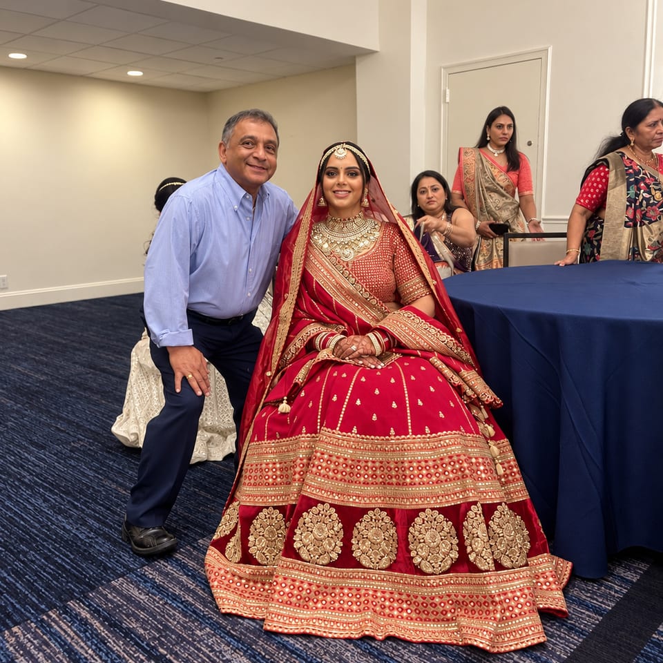 Two guests posing at an indoor wedding celebration