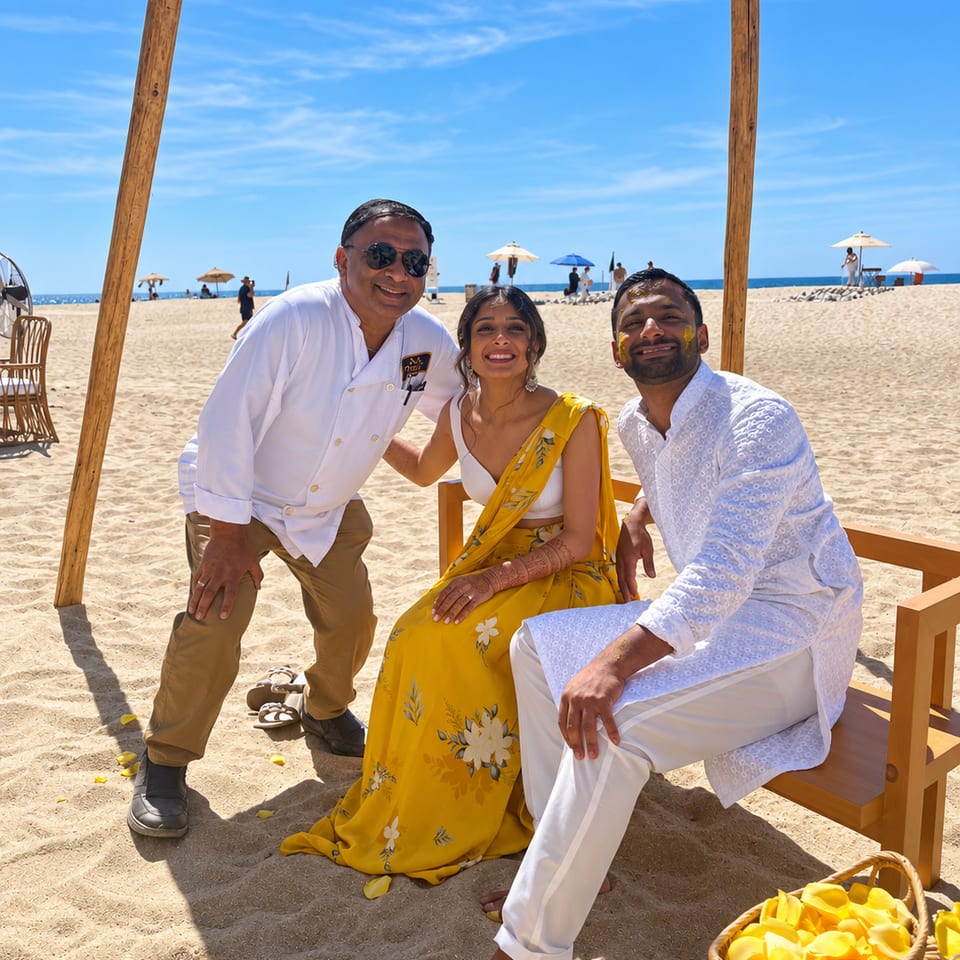 Chef with a couple at a beach celebration