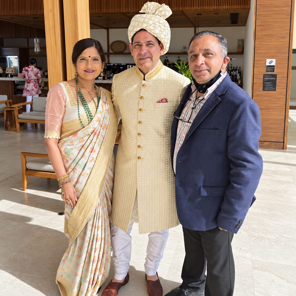 Three guests in wedding attire