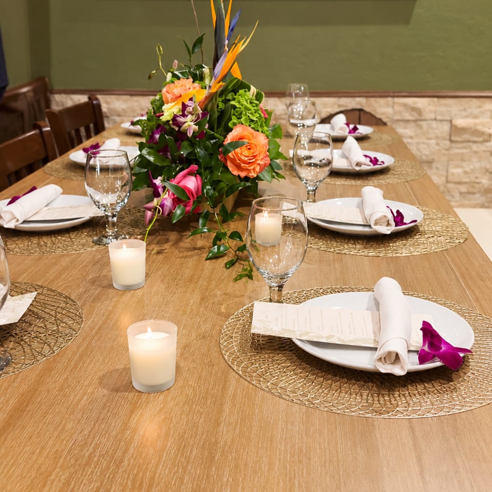 Dining table styled with flowers and candles