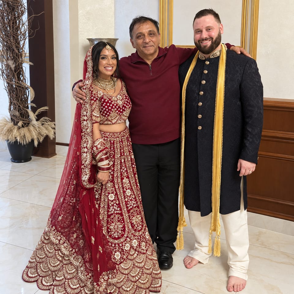 Three guests posing at a wedding celebration